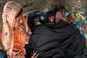 সব পুড়েছে আগুনে, স্বামী ফেরেননি, এক মা অপেক্ষায় তিন সন্তানকে আঁকড়ে